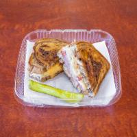 Reuben Sandwich · Grilled pastrami or turkey, Swiss cheese, coleslaw or sauerkraut, Thousand Island dressing o...