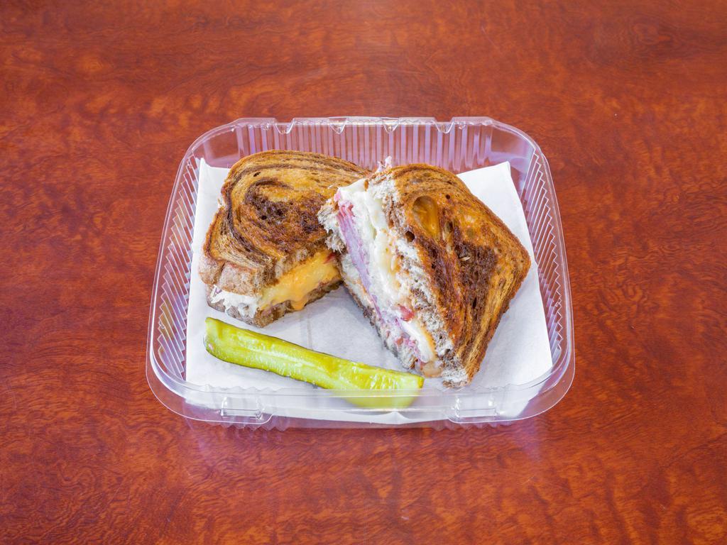 Reuben Sandwich Meal · Grilled pastrami or turkey, Swiss cheese, coleslaw or sauerkraut, Thousand Island dressing on grilled marbled rye.