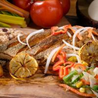 Escovitch Fish · This perfectly fried red snapper comes marinated in a zesty sauce of vinegar, spices, onions...