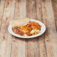 Huevos Rancheros · 2 eggs cooked to order on a bean covered corn tortilla, smothered in green Chile. Served wit...