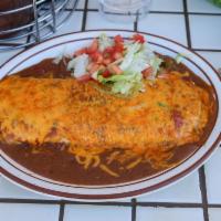 Chile Relleno Burrito with beans inside · Smothered in Regular green chile or extra hot green chile and garnished with lettuce and tom...