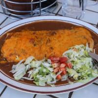 Taco Rito · Ground beef, cheese, lettuce and tomatoes, in a large flour tortilla with melted cheese on t...