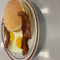 Pancakes Combo · 2 eggs, and choice of 2 bacon strips or 2 sausage links.
