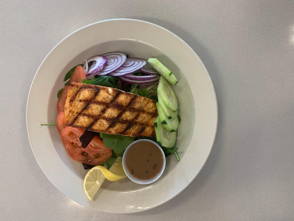 Salmon salad · Grilled salmon , mix green ,tomatoes, red onions , cucumber , limon  ,and  balsamic vinager