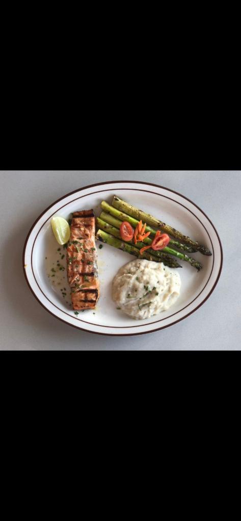 Salmon Dinner · 8 oz. of grilled wild Alaskan fillet, served with grilled asparagus and mashed potatoes.