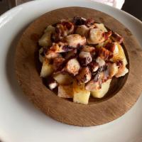 Octopus Gallegos · Baby octopus over steam potatoes, with Spanish peppers, fresh garlic, and extra virgin olive...