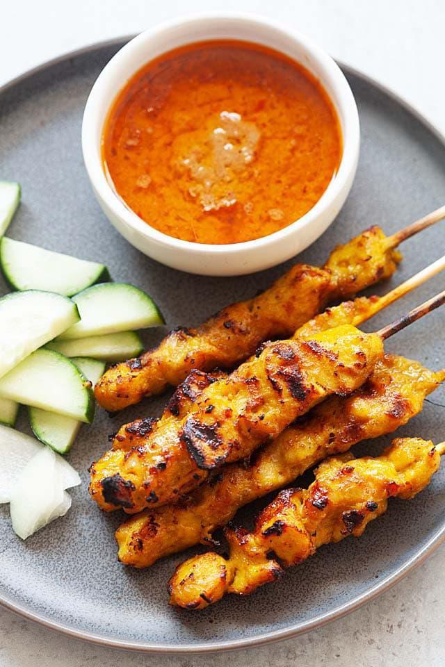 A4. Chicken Satay · 5 pieces. Skewer chicken marinated with Thai taste special sauce grilled under browned. Served with peanut sauce and cucumber sauce.
