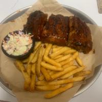 Fire braised BBQ Ribs · Half Rack of St Louis fire braised ribs served with fries and coleslaw.