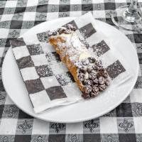 Cannoli · Sweet ricotta & chocolate chip filled Italian pastry.