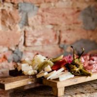 Antipasto Board · Serves 2-3 people. Cured meats, artisan cheese, olives, roasted peppers and vegetables. 