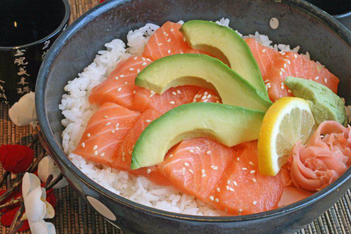 Salmon Sushi Bowl · Sushi rice, salmon, sesame seeds, seaweed, ginger, wasabi, and lemon.