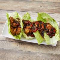 Lettuce Wraps Plate · Pan seared chicken with poblano and red peppers, carrots, green onion and a house made Asian...