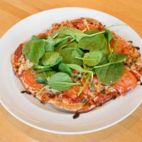 Red Margherita Pizza · Fresh mozzarella, basil, marinated tomatoes and spinach.