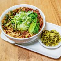 spicy oxtail beef noodle soup · spicy oxtail beef soup with handmade noodles topped with leeks, green onions and served with...