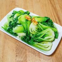 sauteed baby bok choy with garlic  · baby bok choy sautéed with garlic and topped with sliced garlic crisp