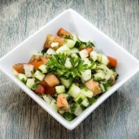 Shirazi Salad · Chopped cucumber, tomatoes, fresh herbs and onion served with house dressing.