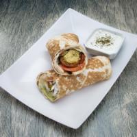 Falafel Sandwich · Fried chickpea patties, served with lettuce, tomatoes, onions and tahini sauce. Includes a s...
