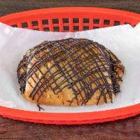 Chocolate Croissant · Topped with a chocolate drizzle