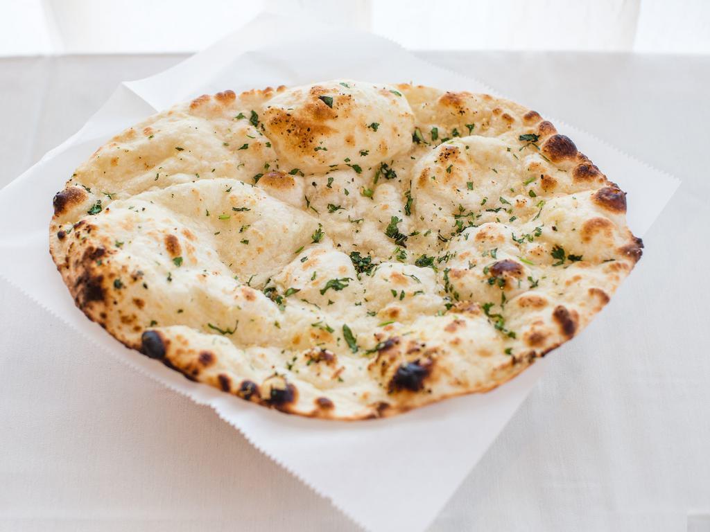 Butter Naan · Simple naan with garlic and butter.