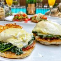 Florentine Eggs Benedict* · Poached Eggs, Spinach, Tomato, English Muffin and Parmesan Sauce