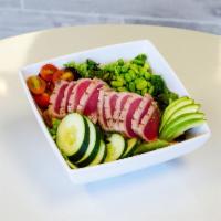 Seared Tuna Salad · A bed of mixed greens, seared tuna, edamame, avocado, sweet cherry tomatoes, cucumbers, and ...