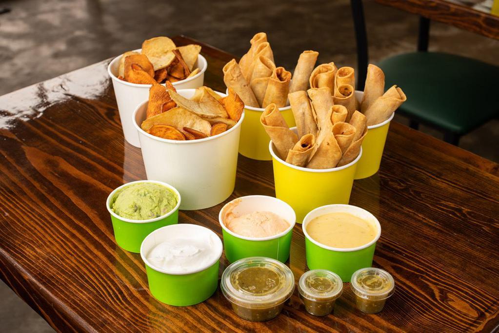 4-5 Family Combo · Choose 3-6 pk tacos, 2 Lg Chips, 4- 5oz dips. Two green salsa Feeds 4-5 (no drinks)
