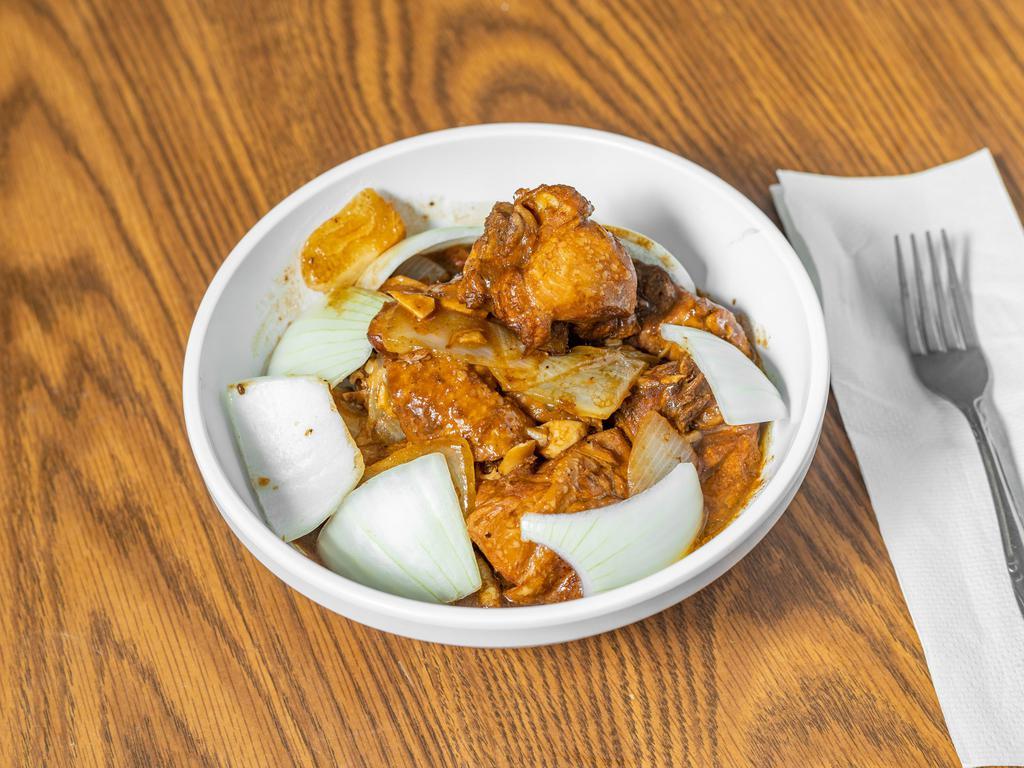 Chicken Adobo · Chicken, bay leaves, soy sauce, vinegar, peppercorn, garlic, and onion.