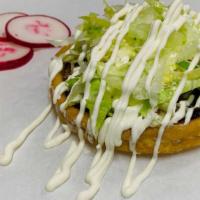 Sopes · Homemade thick tortilla, refried beans, lettuce, sour cream, cheese, and green salsa. Choice...
