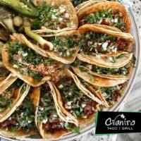 Charola de Tacos · Tacos tray. 20 tacos. Served with cilantro and onion or lettuce and tomatoes, salsas.