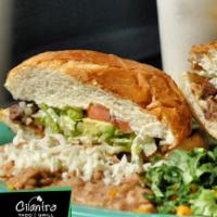 Tortas · Served with lettuce, tomato, avocado, beans, cheese and sour cream.