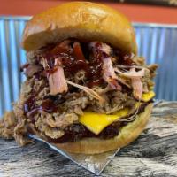 Hog Molly Cheeseburger · Smoked classic cheeseburger with pulled pork and topped with our signature blue berry BBQ sa...