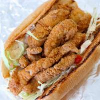 Catfish Po' Boy · Fried hand-breaded catfish tenders served on a toasted French baguette served with pico de g...
