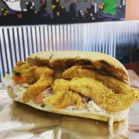 Chicken Po' Boys · Fried hand-breaded chicken tenders served on a toasted French baguette served with pico de g...