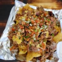 Smoked Pulled Pork Nachos · Freshly fried tortilla chips topped with your choice of mild cheddar, spicy cheddar or our s...