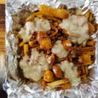 Poutine · Fresh hand-cut fries loaded with our signature brisket gravy and topped brisket queso. Fried...