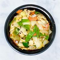 25. Gang Keowarn · Stir-fried with carrots, green peppers, onions, egg plant, pea pods, and basil with a Thai c...