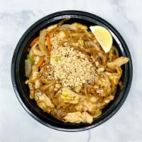 41. Pad Thai · Stir-fried rice noodles with onions, carrots, green peppers, celery, and eggs, topped with p...
