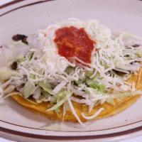 Super Taco · Choice of meat, lettuce, cheese, sour cream, guacamole and salsa.