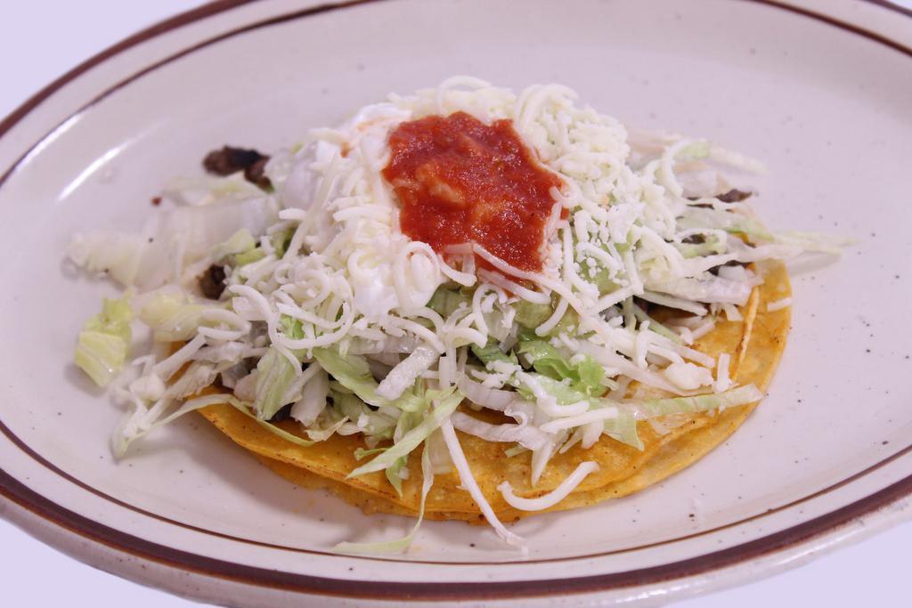 Super Taco · Choice of meat, lettuce, cheese, sour cream, guacamole and salsa.