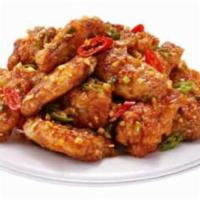 Gangnam Style Wings · Fried wings lightly battered then sautéed with peppers, garlic in an aromatic tangy, black p...