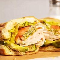 Turkey & Avocado Sandwich · Turkey, avocado, alfalfa sprouts, tomato, red onion, romaine, whole grain mustard and mayo.