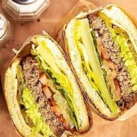 Avocado Burger · Beef Patty, Avocado, Jalapeno, Pepper Jack, Tomato, Onion, Romaine, mayo & pesto ranch on Ha...