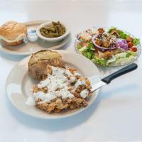 Chicken Fried Steak · A generous portion of hand breaded beef ladled with cream gravy. Served with vegetable, choi...