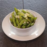 Garlic Edamame · Boiled green soybeans sautéed with olive oil and garlic.