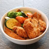 Chicken Katsu · Breaded chicken thigh that’s been deep fried on a bowl of freshly steamed rice served with k...