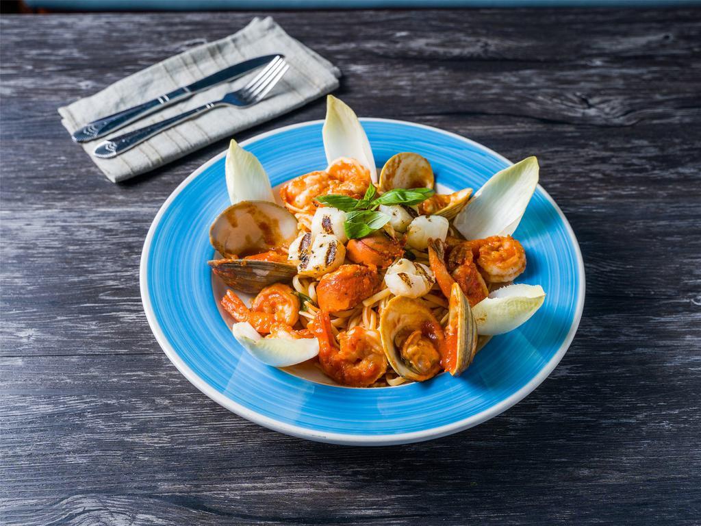 Thalassina Pasta · Sauteed seafood of clams, scallops, shrimp and lobster tail with light tomato sauce over your choice of pasta: linguini or penne.