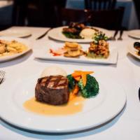 Filet Mignon · Chargrilled to perfection and topped with our signature zip sauce. Served with our roasted g...