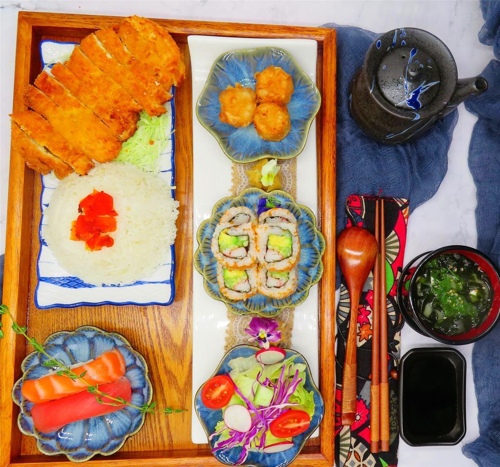 Chicken Katsu Bento Box · Served with miso soup, green salad, California roll, shumai, sushi and rice.