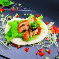 3.Peking Duck Bun · 8 Pieces. Inside:PEKING Duck with scallion ,cucumber,lettuce,and seafood sauce