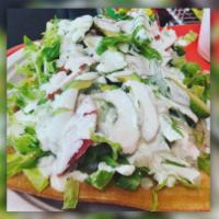 Chilindrina · Wheat flour grinds topped with pickled pork rinds, lettuce or cabbage, tomatoe slices , avoc...